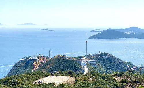 High angle view of sea and buildings against sky