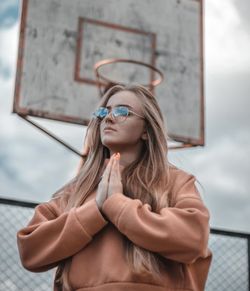 Portrait of beautiful young woman wearing sunglasses