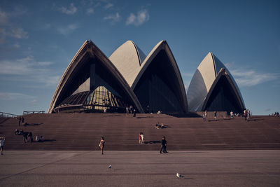 Group of people walking in front of building