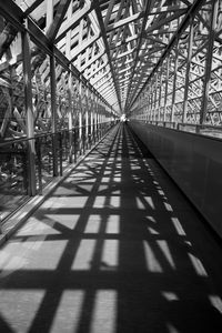Shadow of bridge on footbridge