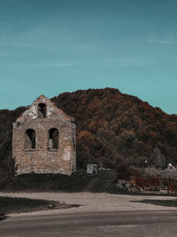 Abandoned building against clear sky