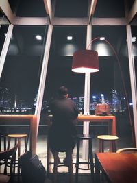 Rear view of man sitting in restaurant