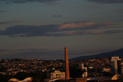 Cityscape against cloudy sky