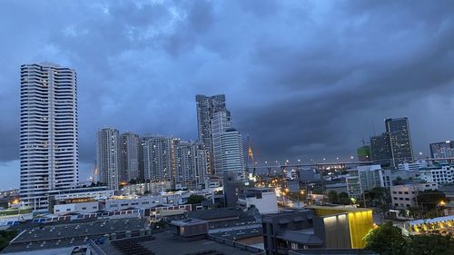 Modern buildings in city against sky