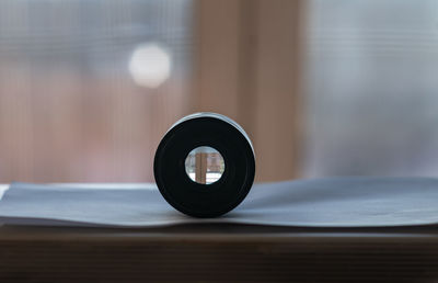 Close-up of lens on table