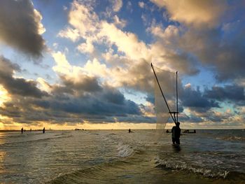 Scenic view of sea against cloudy sky