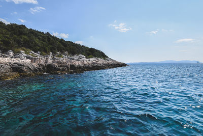 Scenic view of sea against blue sky