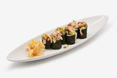 High angle view of food in plate against white background