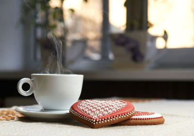 Close-up of coffee cup on table