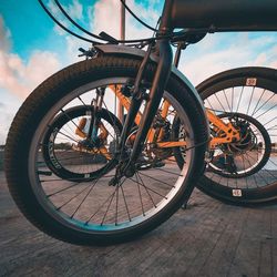 Close-up of bicycle wheel on street