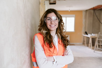 Smiling professional confident architect woman in construction site. home renovation