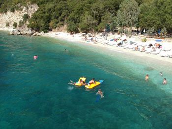 High angle view of people enjoying at beach