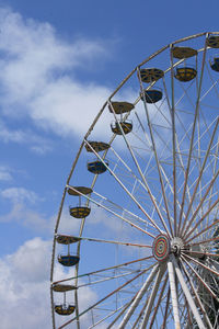 Low angle view of ferris wheel against sky