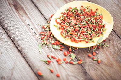 High angle view of red chili peppers on table