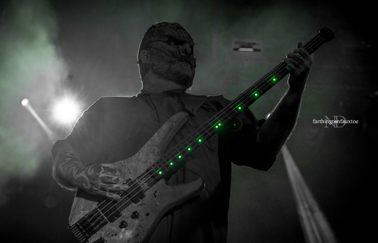 MAN PLAYING GUITAR ON STAGE