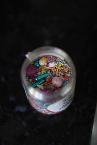 High angle view of multi colored candies on table