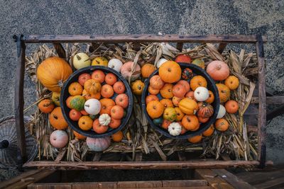 Overhead view of pumpkins in wooden container