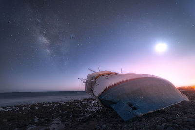 Scenic view of sea against sky at night