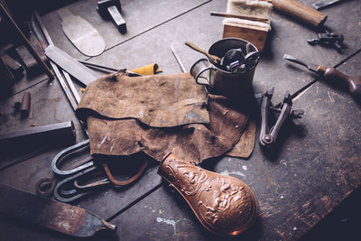 High angle view of old work tools on table