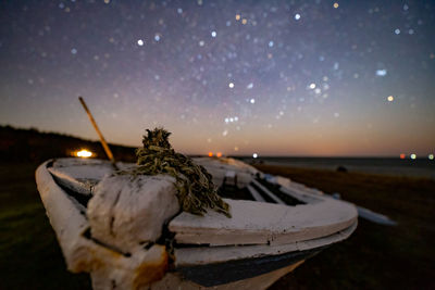 Scenic view of beach against sky at night