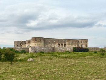 View of old ruin building in field