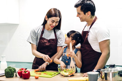 Friends standing on cutting board