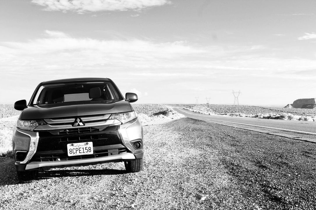 CAR ON ROAD BY LAND