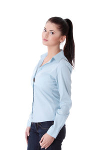 Young woman standing against white background