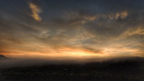 Scenic view of dramatic sky during sunset