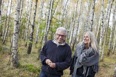 Senior couple walking in forest, delsjon, gothenburg, sweden