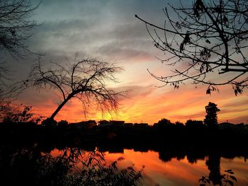 Scenic view of lake at sunset