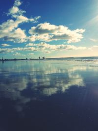 Scenic view of sea against cloudy sky