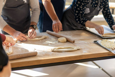 People preparing food on table