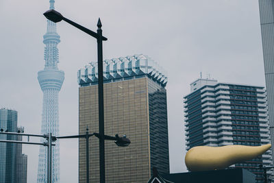 Low angle view of buildings against sky in city