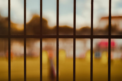 Full frame shot of metal fence against sky