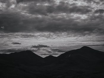 Scenic view of mountain against cloudy sky