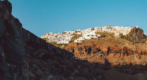 Scenic view of rocky mountains against clear blue sky