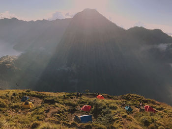 Tents on mountains against sky