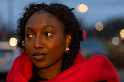 Portrait of young woman looking away