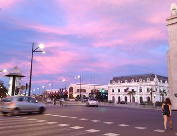 View of city street at sunset
