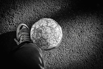 Low section of person standing on tiled floor