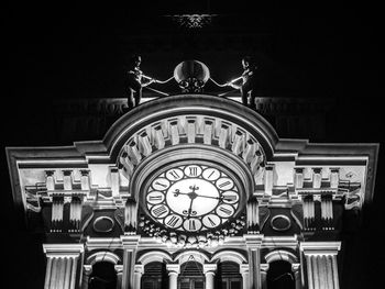 Low angle view of illuminated building at night