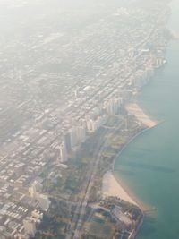 Aerial view of cityscape against sky