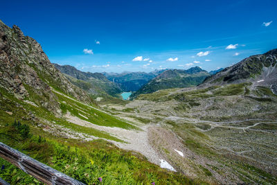 Scenic view of mountains against blue sky