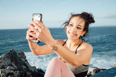 Young woman using mobile phone