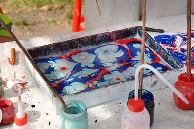 High angle view of painting equipment on table