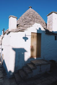 Exterior of old building against clear blue sky