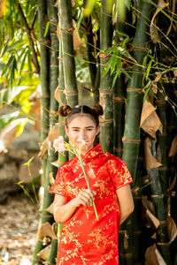 Woman holding a plant