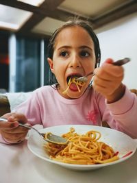 Close-up portrait of a boy eating food