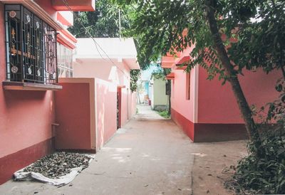 Empty alley amidst buildings in city